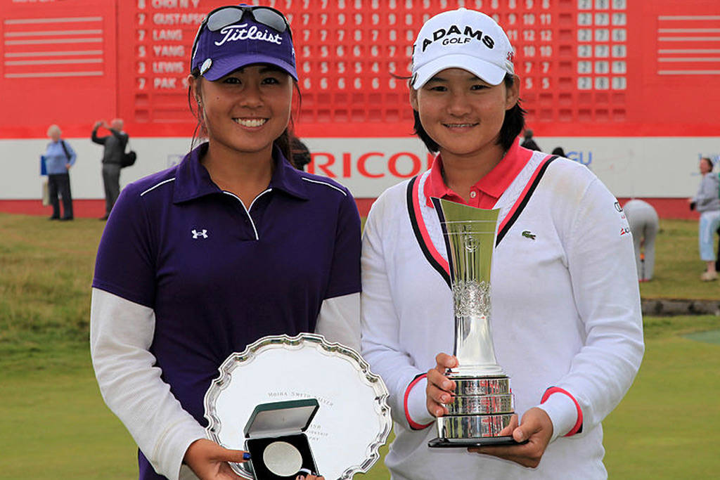 Danielle Kang (left) and Yani Tseng pose with their trophies after the 2011 British Women's Open